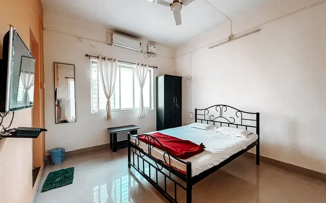 Executive room at Airawat with a wardrobe and dressing table