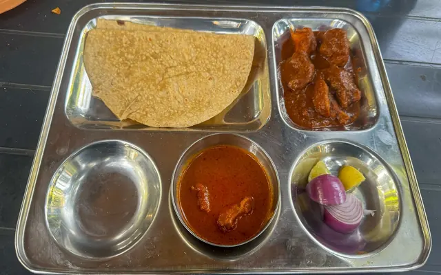 Konkan thali with fish curry and chapati at Airawat