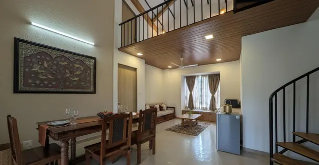 Drawing hall and dining table, with the staircase to the bedroom upstairs