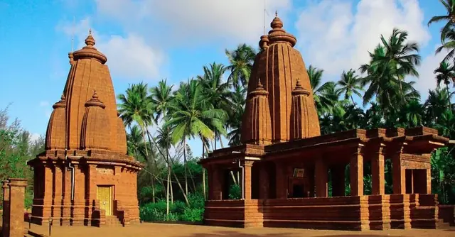 Two stone temples under a clear sky
